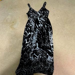 Black and white sun dress. Flowy. Cross V-neck. Size small. 100% polyester.